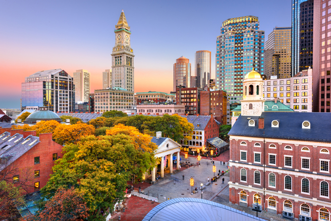 Boston, Massachusetts skyline with Faneuil Hall and Quincy Market at dusk.